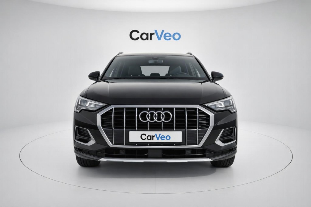 Enhanced vehicle in white studio with branding on wall and plate